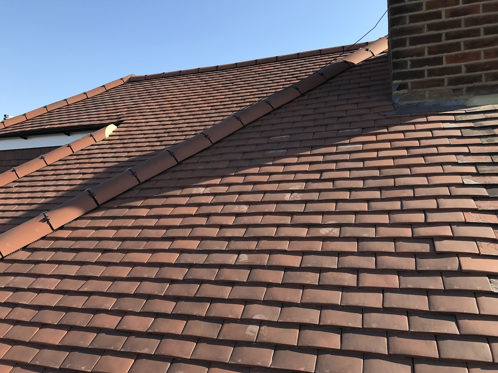 Full re-roofs in concrete or clay tile, with ridges, valleys and lead done properly.